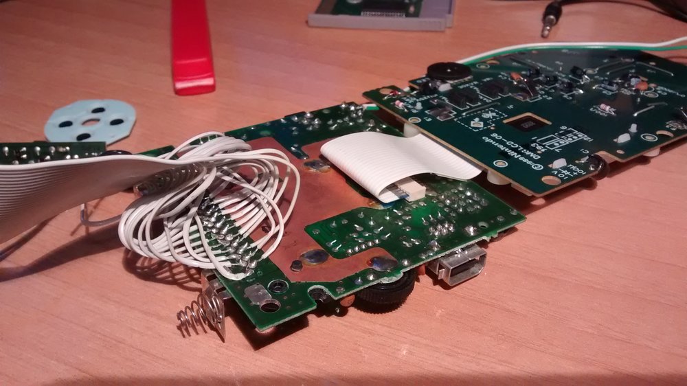 Back of the GameBoy PCB with the cartridge pins soldered to a FDD ribbon.